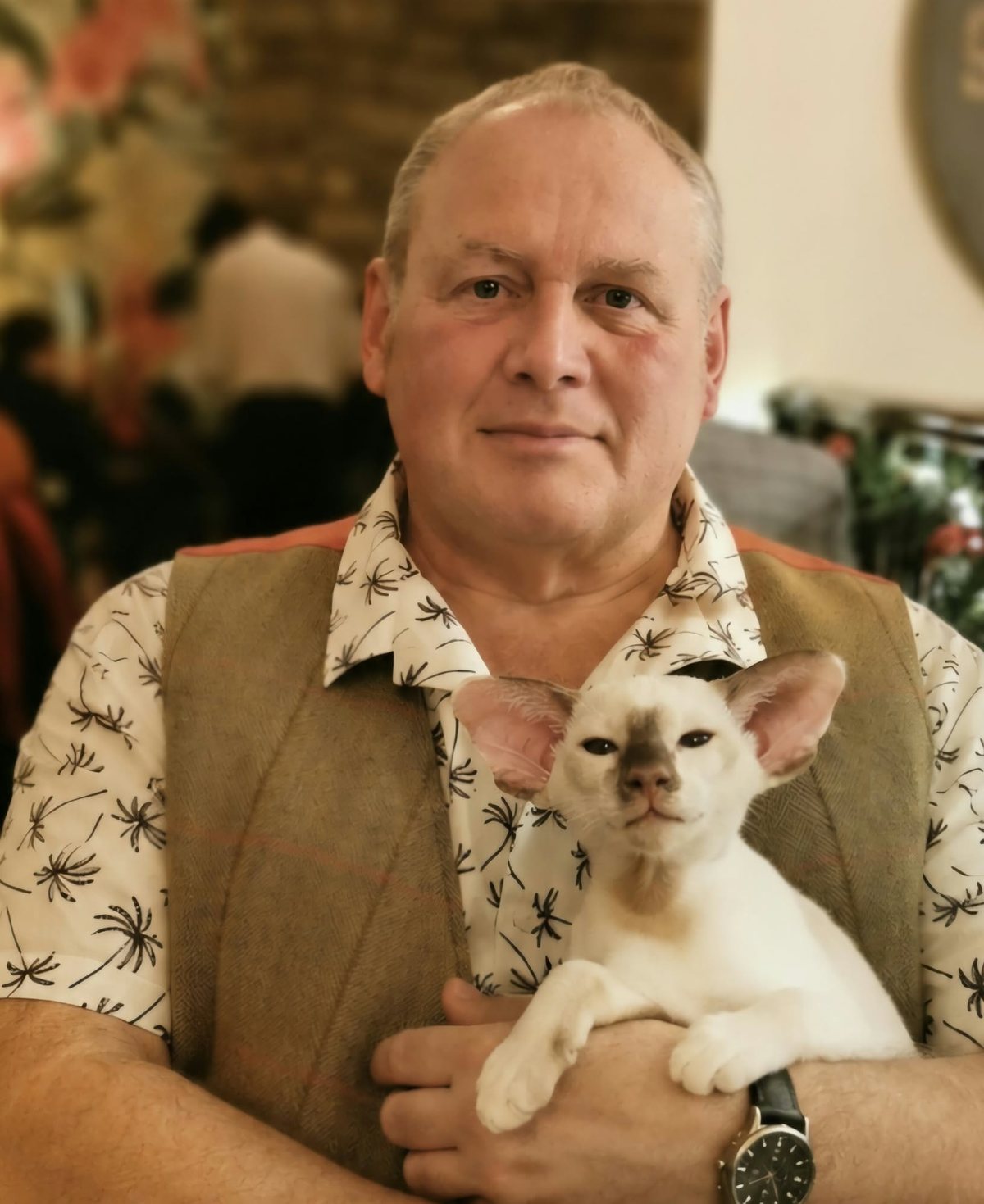 Chris Taylor of Tinkertaylor holding one of their kittens